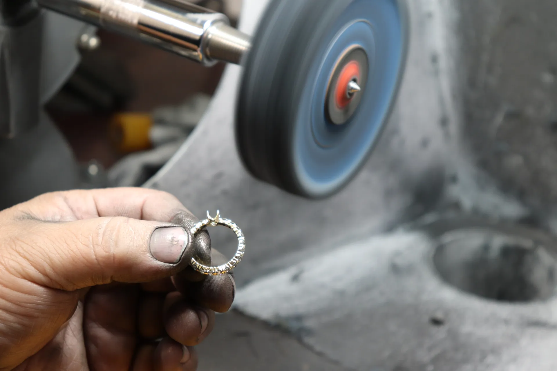 Jeweler polishing a piece